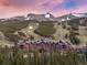 A large ski resort hotel nestled among evergreen trees with a mountain in the background at 1521 Ski Hill Rd # 8313, Breckenridge, CO 80424