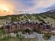 Aerial view of One Ski Hill Place, featuring stunning mountain views and manicured landscaping at 1521 Ski Hill Rd # 8313, Breckenridge, CO 80424