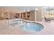 Bright indoor hot tub room with stone tile, recessed lighting and multiple windows with outdoor views at 1521 Ski Hill Rd # 8313, Breckenridge, CO 80424