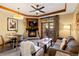 Inviting living room with a fireplace, dining table, comfortable seating, and balcony access at 1521 Ski Hill Rd # 8313, Breckenridge, CO 80424