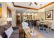 Open-concept living room and kitchen with wood accents, modern appliances, and dining area at 1521 Ski Hill Rd # 8313, Breckenridge, CO 80424
