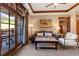 Cozy living room with balcony access offering natural light and comfortable seating arrangements at 1521 Ski Hill Rd # 8313, Breckenridge, CO 80424