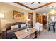 Comfortable living room with a plush grey sofa, stylish decor and wooden beam ceiling at 1521 Ski Hill Rd # 8313, Breckenridge, CO 80424