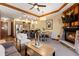 Spacious living room with a stone fireplace, dining area, and modern furnishings at 1521 Ski Hill Rd # 8313, Breckenridge, CO 80424