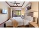 Comfortable bedroom with ceiling fan, art, and a window view bringing natural light into the room at 1521 Ski Hill Rd # 8313, Breckenridge, CO 80424