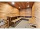 Wood paneled sauna room with built-in bench seating and recessed lighting at 1521 Ski Hill Rd # 8313, Breckenridge, CO 80424