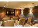 Theater room with tiered seating, large screen, and wooden cabinets at 1521 Ski Hill Rd # 8313, Breckenridge, CO 80424