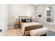 Cozy bedroom with a comfortable bed and neutral decor at 8260 E 36Th Ave # 29, Denver, CO 80238