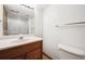 Bathroom features vanity with ample counter space, updated hardware, and a shower/tub at 8229 S Ogden Cir, Littleton, CO 80122