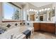 Bright bathroom with a garden tub, dual sinks, and ample natural light at 8229 S Ogden Cir, Littleton, CO 80122