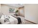Cozy bedroom featuring a large closet, soft carpet, and a comfortable bed at 8229 S Ogden Cir, Littleton, CO 80122