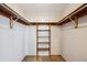 Organized walk-in closet with ample shelving and storage space at 8229 S Ogden Cir, Littleton, CO 80122