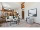 Inviting living room with open floor plan, plush seating, and access to kitchen at 8229 S Ogden Cir, Littleton, CO 80122