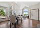 Bright living room with vaulted ceilings, large windows, and hardwood floors at 8229 S Ogden Cir, Littleton, CO 80122