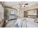 Spacious main bedroom with a vaulted ceiling, elegant dresser, and ensuite access at 8229 S Ogden Cir, Littleton, CO 80122