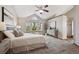 Serene main bedroom with vaulted ceiling, large windows, and calming neutral tones at 8229 S Ogden Cir, Littleton, CO 80122