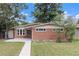 Charming brick home with a well-maintained lawn, mature trees, and inviting walkway to the front door at 400 W Midway Blvd, Broomfield, CO 80020