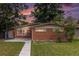 Charming single-story brick home with a well-maintained lawn and a tidy sidewalk leading to the front door at 400 W Midway Blvd, Broomfield, CO 80020