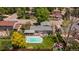 Aerial view of home with swimming pool and spacious backyard in a peaceful neighborhood at 6474 W Canyon Ave, Littleton, CO 80128