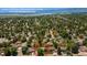 Aerial view showcasing a neighborhood near Chatfield Reservoir with tree coverage at 6474 W Canyon Ave, Littleton, CO 80128
