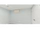Finished basement room with carpeting, neutral paint, and a door at 6474 W Canyon Ave, Littleton, CO 80128
