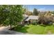 Aerial view of a home with a well-manicured lawn and mature trees offering ample shade and privacy at 6474 W Canyon Ave, Littleton, CO 80128
