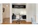 Bright office nook featuring dark cabinets and drawers, a white chair and a built-in desk, creating an ideal workspace at 6474 W Canyon Ave, Littleton, CO 80128