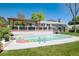 Backyard swimming pool with colorful floats, deck, pergola, and inviting outdoor space at 6474 W Canyon Ave, Littleton, CO 80128