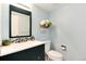 Light and airy powder room with blue walls, a modern vanity, and stylish decor for a fresh aesthetic at 6474 W Canyon Ave, Littleton, CO 80128