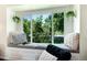 Cozy window seat with plush cushions, providing a serene spot to relax and enjoy the outdoor view at 6474 W Canyon Ave, Littleton, CO 80128