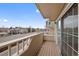 Inviting balcony with wood floors and neighborhood views provides a great outdoor space at 1818 S Quebec Way # 7-8, Denver, CO 80231