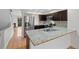 Updated kitchen featuring granite countertops and stainless steel appliances at 1818 S Quebec Way # 7-8, Denver, CO 80231