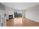 Bright living room with hardwood floors and a fireplace at 1818 S Quebec Way # 7-8, Denver, CO 80231
