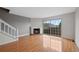 Living room with fireplace and hardwood floors near staircase at 1818 S Quebec Way # 7-8, Denver, CO 80231