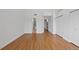 Spacious living room with hardwood floors and access to a bathroom and hallway with closets at 1818 S Quebec Way # 7-8, Denver, CO 80231