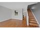 Open-concept living area with hardwood floors and view into the kitchen at 1818 S Quebec Way # 7-8, Denver, CO 80231