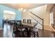 Bright dining room with hardwood floors, a chandelier, and an open layout at 9021 Sandpiper Dr, Frederick, CO 80504