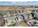 A beautiful aerial view showcases the neighborhood's well-maintained homes and manicured lawns at 16240 E 119Th Ave, Commerce City, CO 80022