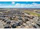 Aerial view of a residential neighborhood, showcasing the layout and surrounding landscape at 16240 E 119Th Ave, Commerce City, CO 80022