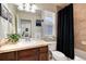 Full bath with tub, vanity, and decorative touches at 16240 E 119Th Ave, Commerce City, CO 80022