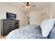 Bedroom includes a dresser with TV and access to the rest of the house at 16240 E 119Th Ave, Commerce City, CO 80022