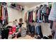 Well-organized walk-in closet with ample storage shelves and hanging space for clothes and accessories at 16240 E 119Th Ave, Commerce City, CO 80022