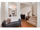 Inviting foyer with hardwood floors, staircase, and stylish decor at 16240 E 119Th Ave, Commerce City, CO 80022