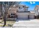 Charming two-story home with a three-car garage and inviting front porch at 16240 E 119Th Ave, Commerce City, CO 80022