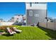 Landscaped backyard with lawn and patio seating at 22042 E 38Th Pl, Aurora, CO 80019