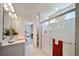 Modern bathroom with double vanity and walk-in shower at 22042 E 38Th Pl, Aurora, CO 80019