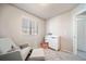 Bedroom with rocking chair and changing table at 22042 E 38Th Pl, Aurora, CO 80019