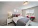Bright bedroom with a queen-size bed and window seating at 22042 E 38Th Pl, Aurora, CO 80019