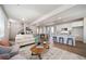 Living room with comfy seating, modern coffee table and fireplace at 22042 E 38Th Pl, Aurora, CO 80019
