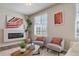 Living area with modern fireplace and comfortable seating at 22042 E 38Th Pl, Aurora, CO 80019